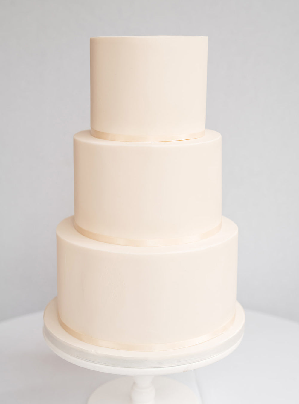 Modern Ivory Wedding Cake with Fondant Flowers and Piping